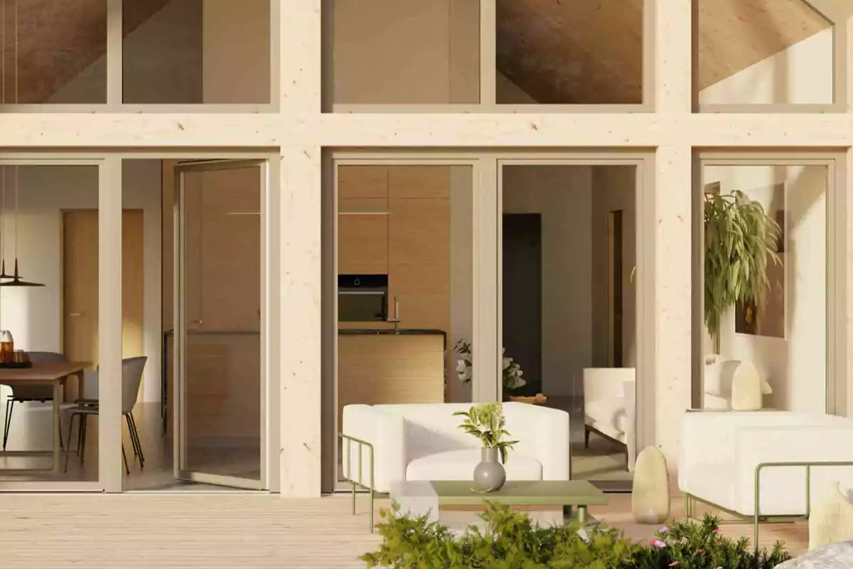 Una sala de estar moderna con grandes ventanales y muebles minimalistas en tonos claros.
