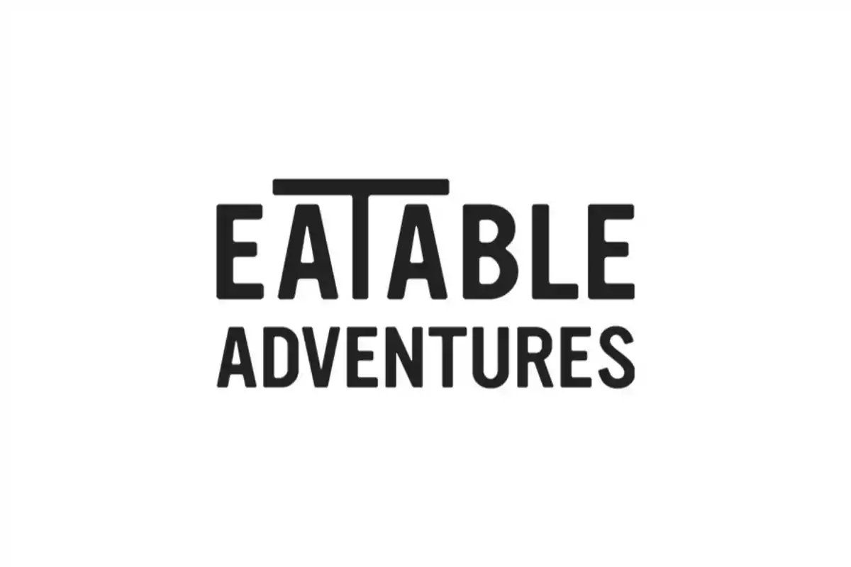 Logotipo de Eatable Adventures en letras negras sobre fondo blanco.